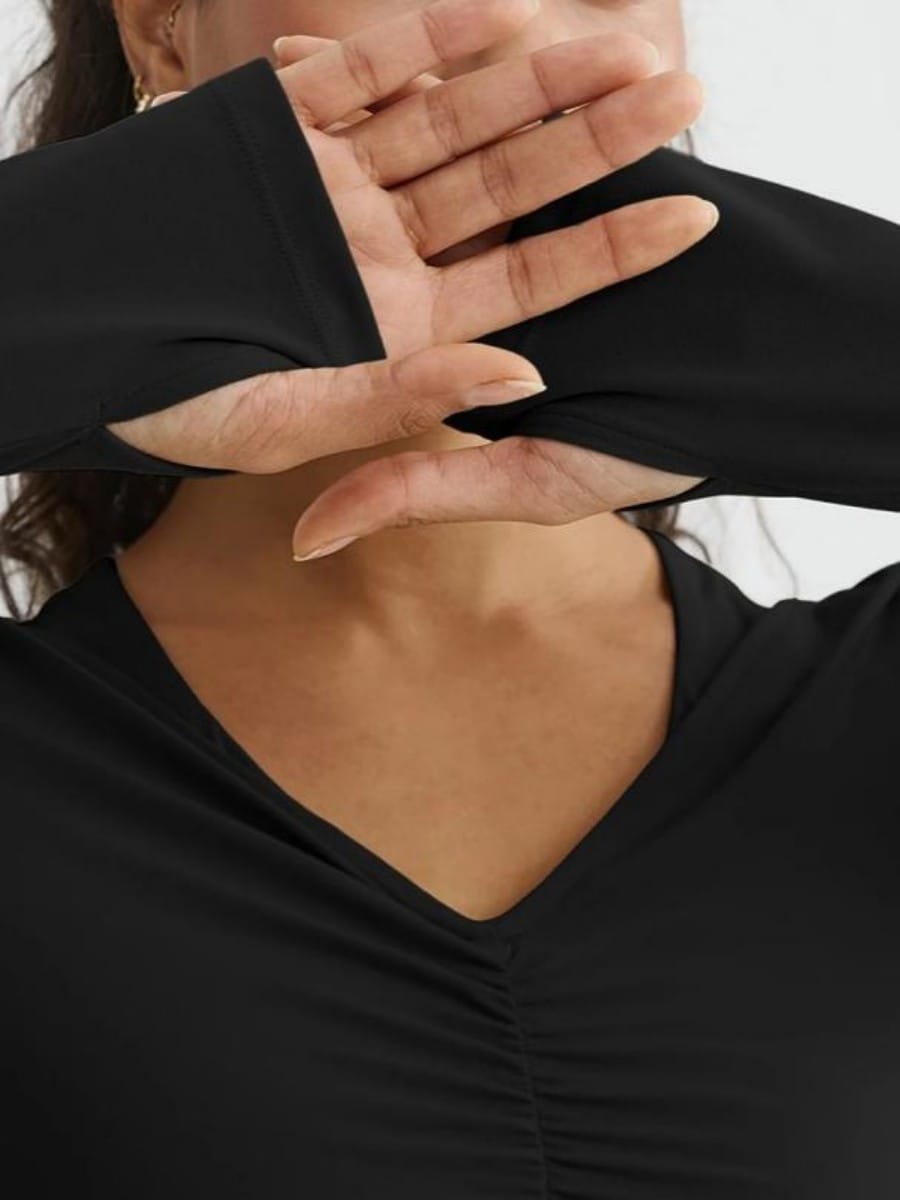 Black long sleeve yoga top thumbhole detail