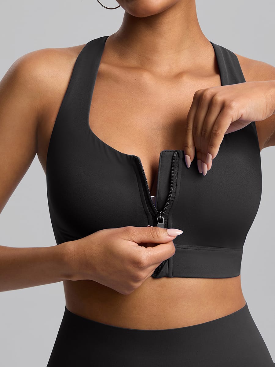 Close-up of the convenient front zipper on Black Vractive sports bra for easy on and off