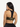 Back view of leopard-print and black splice Vractive sports bra, wholesale activewear
