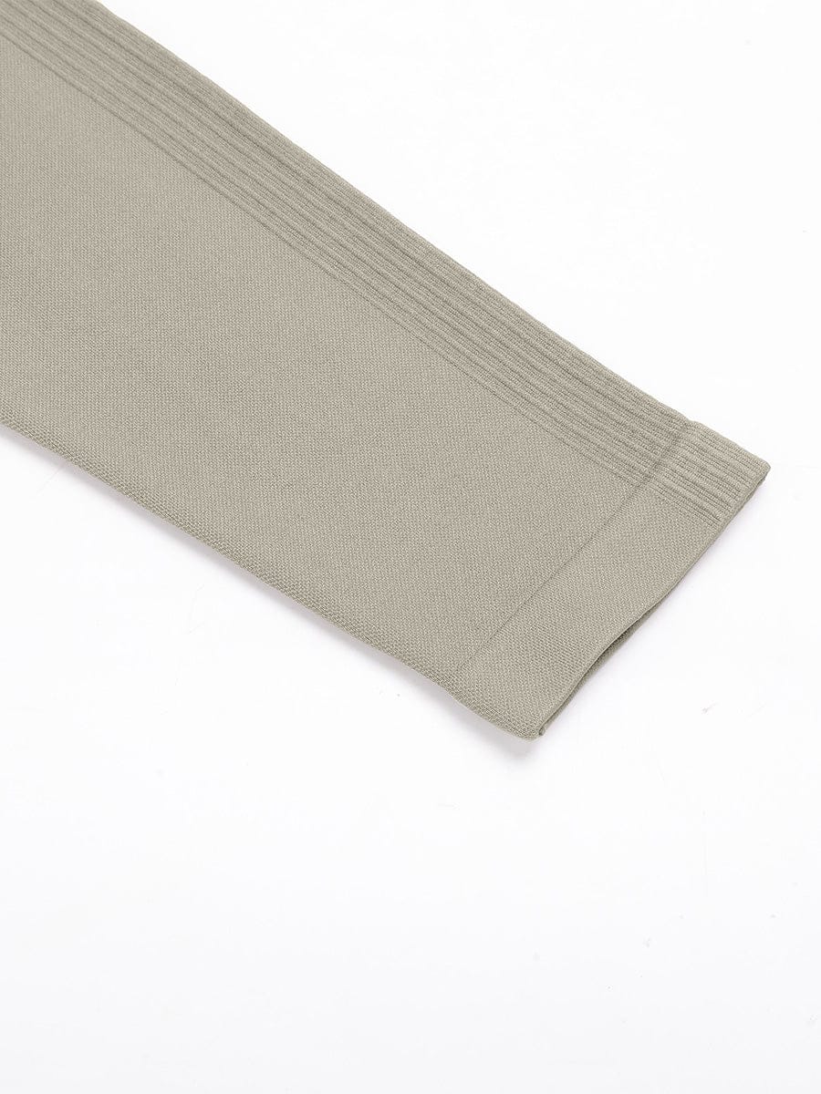 Macro texture of clean and professional ankle hem finish on Brown Vractive activewear leggings