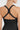 Close-up view highlighting the intricate cross-back strapping on Vractive seamless sports tummy control bra-free jumpsuit, demonstrating premium design for maximum mobility and stylish upper body shape.