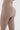 Detail shot of the opaque, four-way stretch Light Brown seamless fabric on Vractive jumpsuit