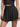 Front view of black Vractive A line skirt, wholesale slimming ruffle hem sports skirt
