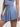 Side view of blue Vractive ruffle hem skirt, wholesale A line sports skirt with built in shorts
