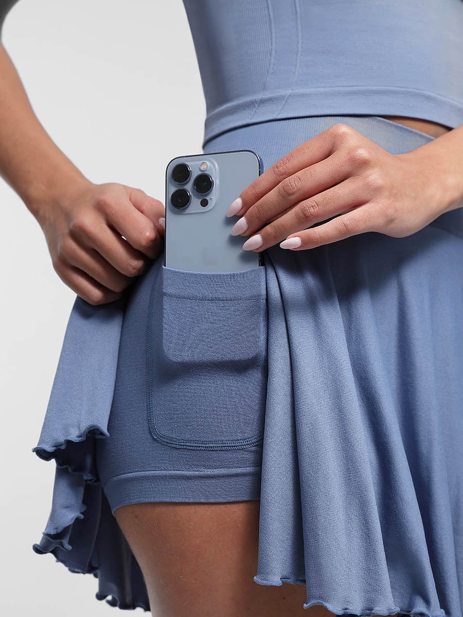 Functional pockets detail of blue Vractive skirt, wholesale built in shorts sports skirt
