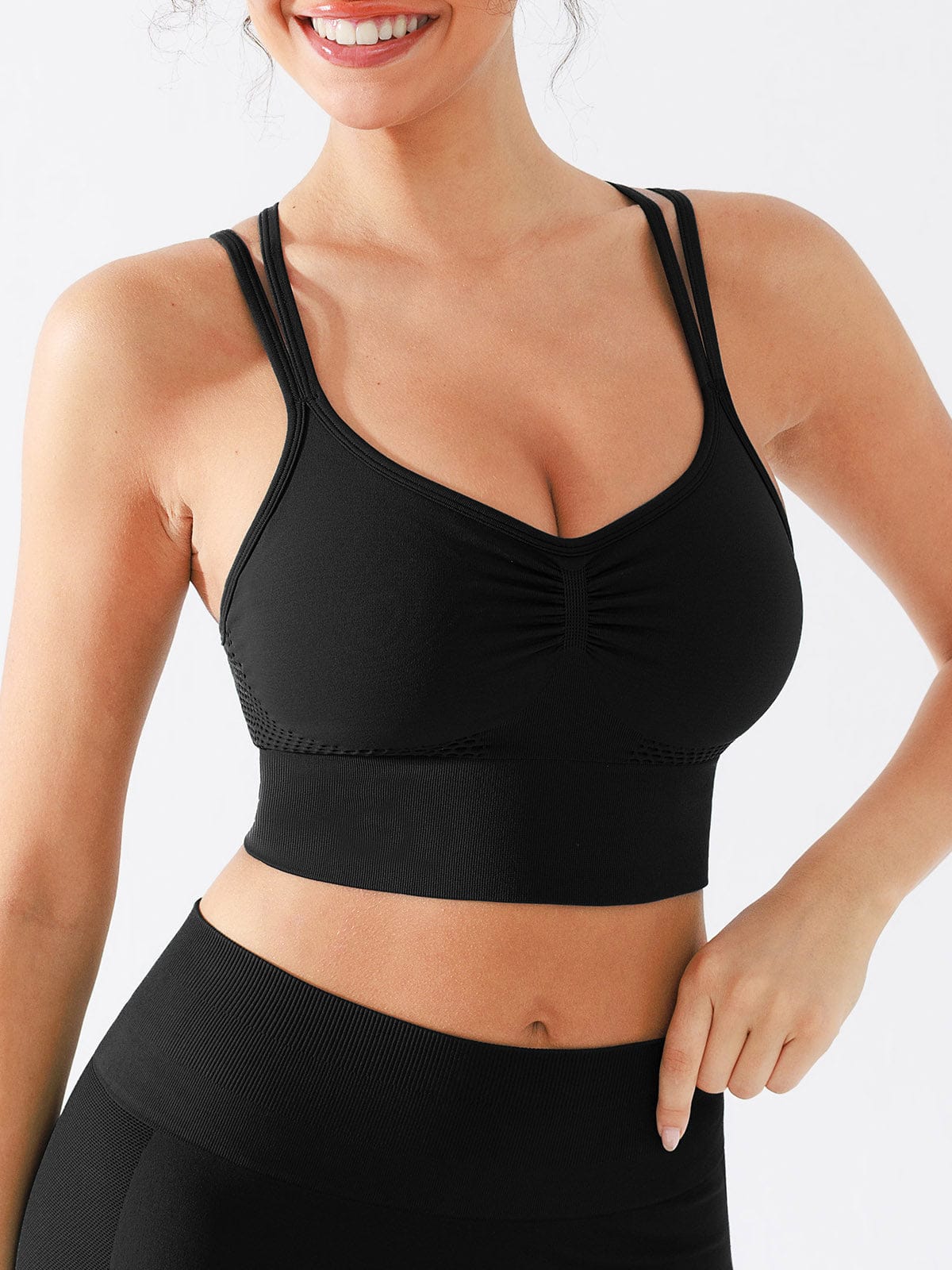 Side angle of Vractive sustainable sports bra in Standard Black