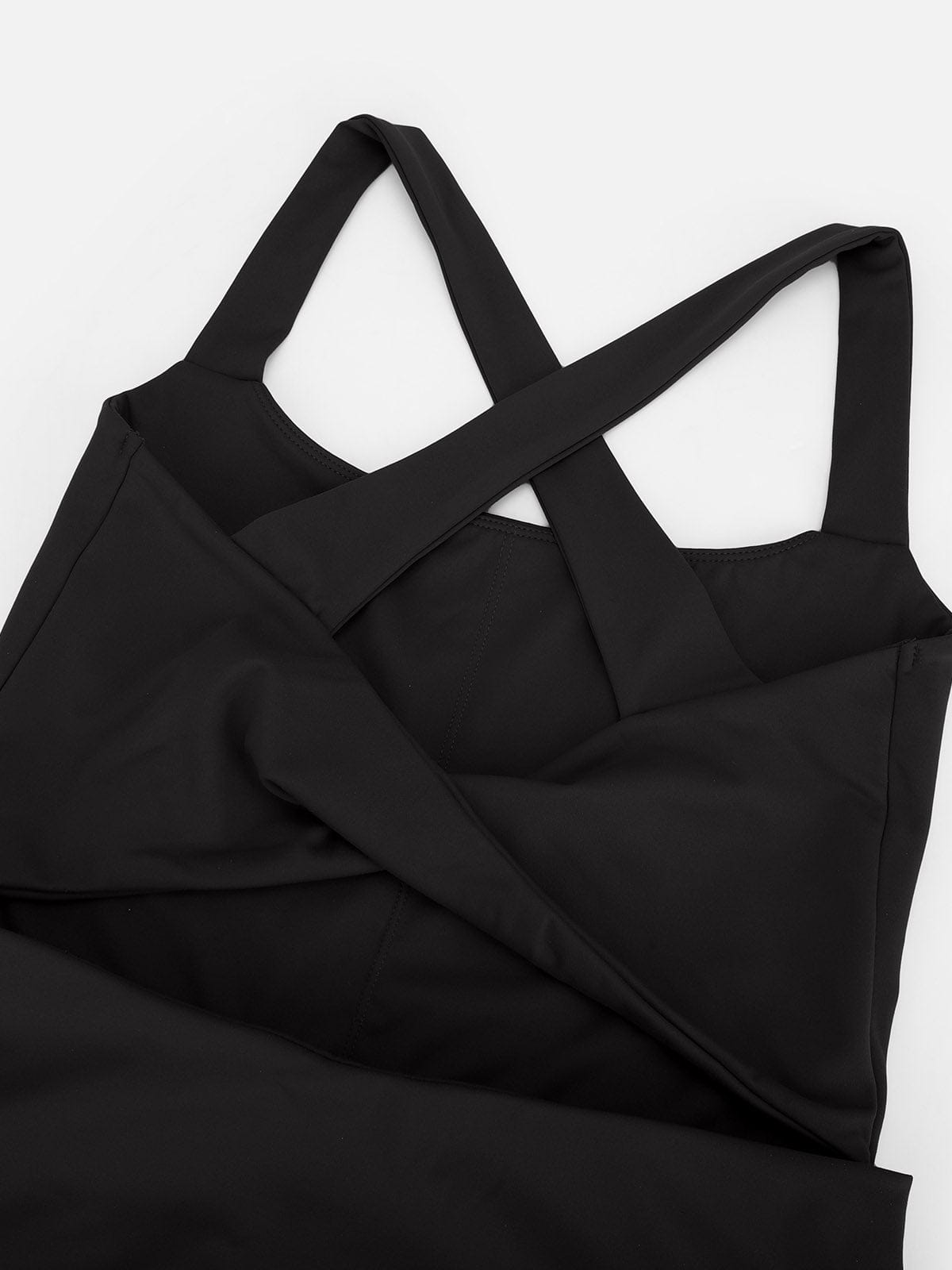 Detail shot of the elegant back strapping and cutout design on Standard Black Vractive athletic dress