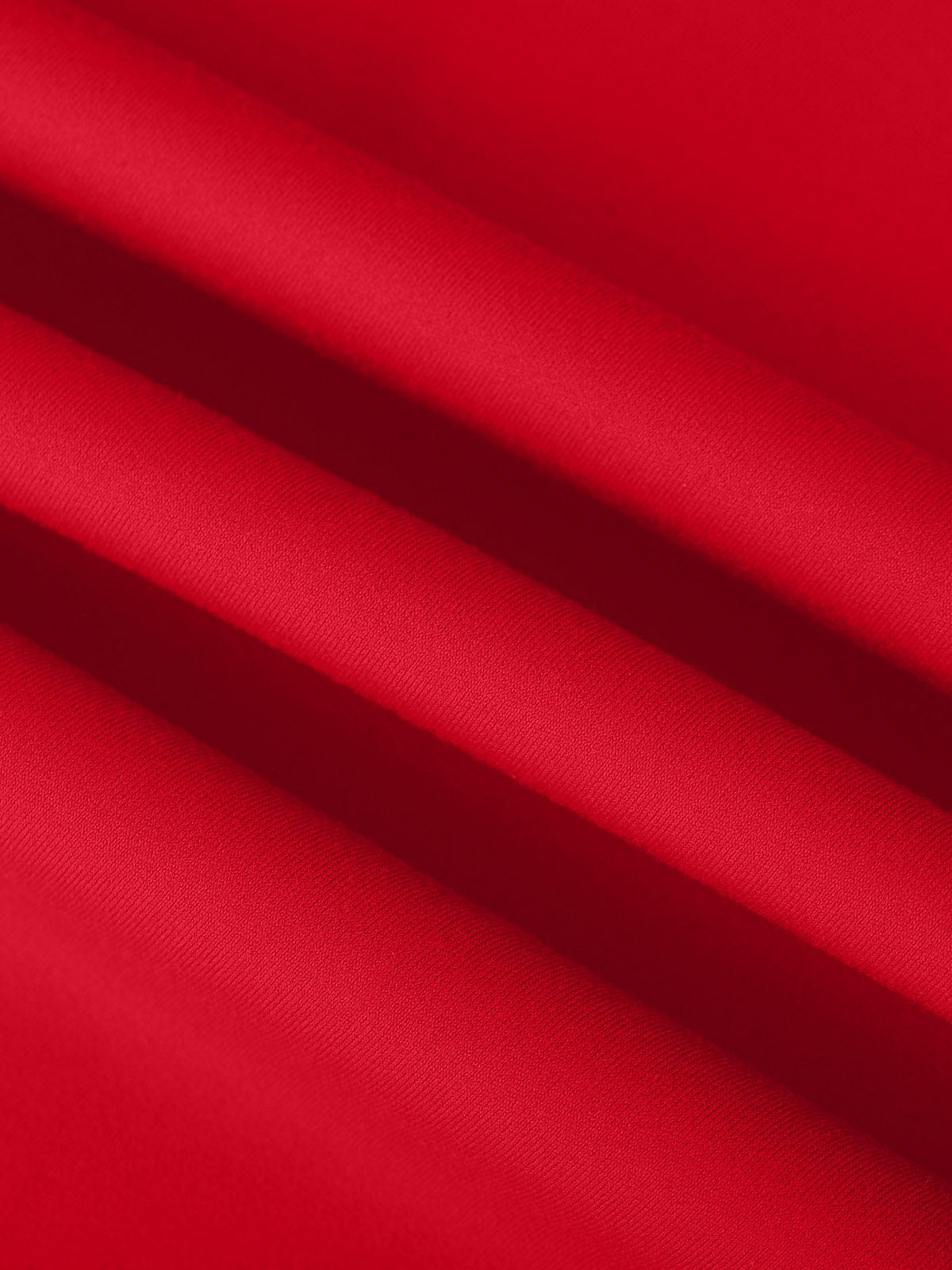Macro texture of the breathable, quick-dry Chili Red fabric on Vractive performance tennis dress