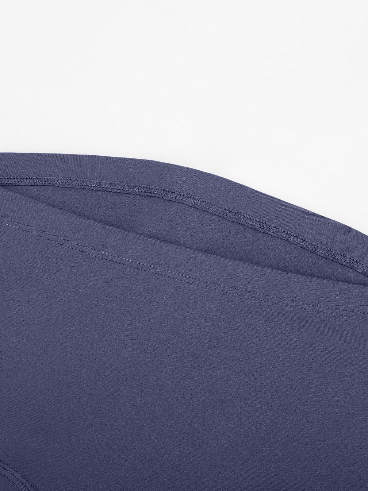 Detail shot of the sculpting seams and scrunch butt construction on Mist Blue Vractive shorts