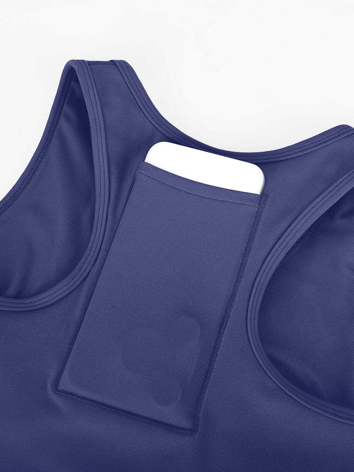 Detail shot of functional back storage pocket on Mist Blue Vractive sports bra