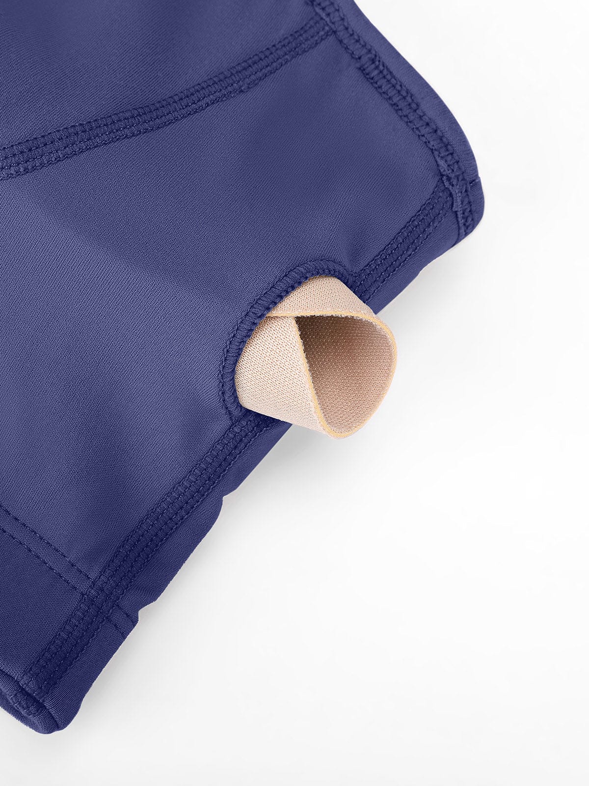 Mist Blue zip sports bra showing easy-to-remove cups for washing and adjustments