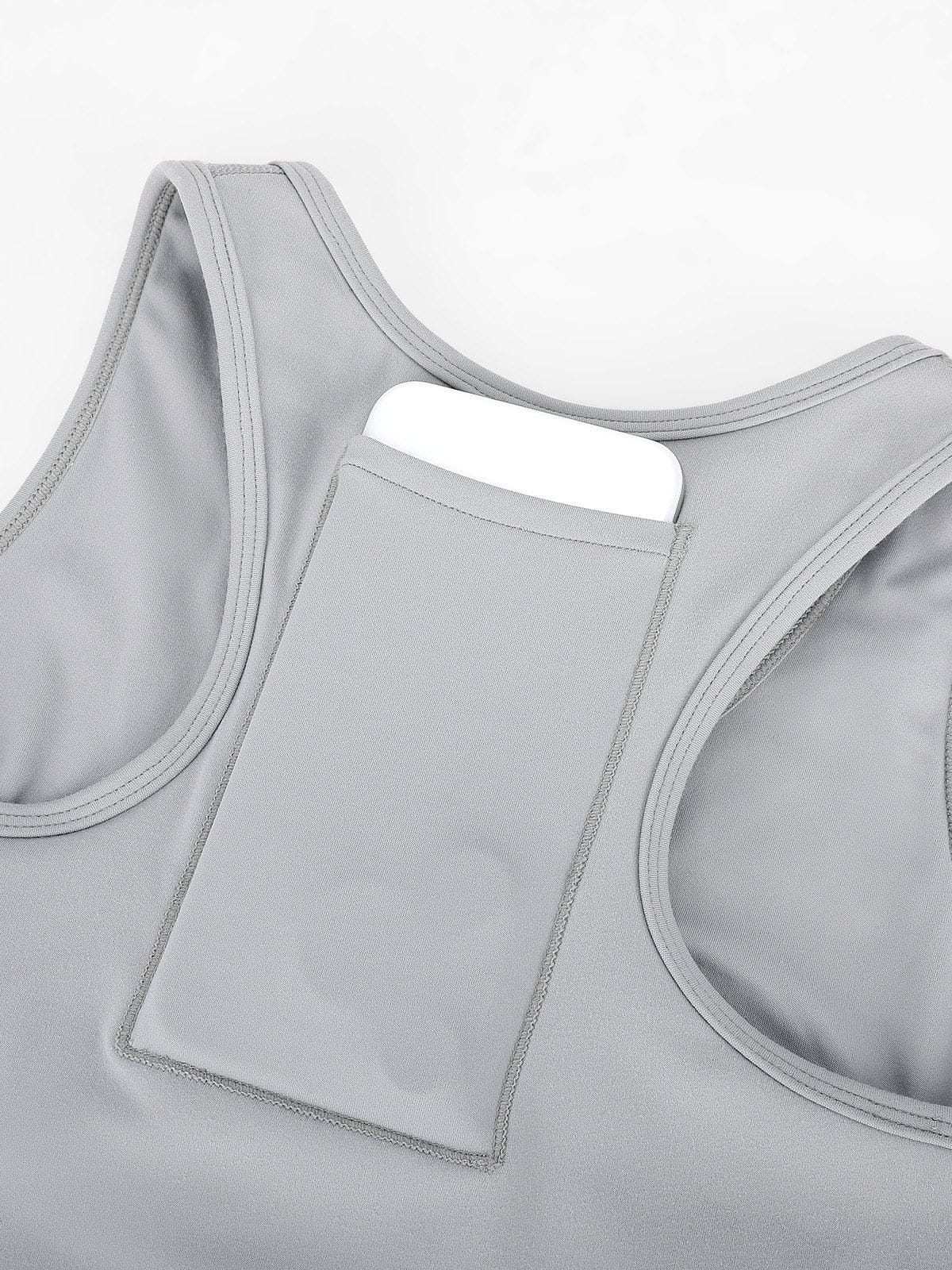 Close-up of the hidden back phone pocket on Vractive Lead Gray zip sports bra