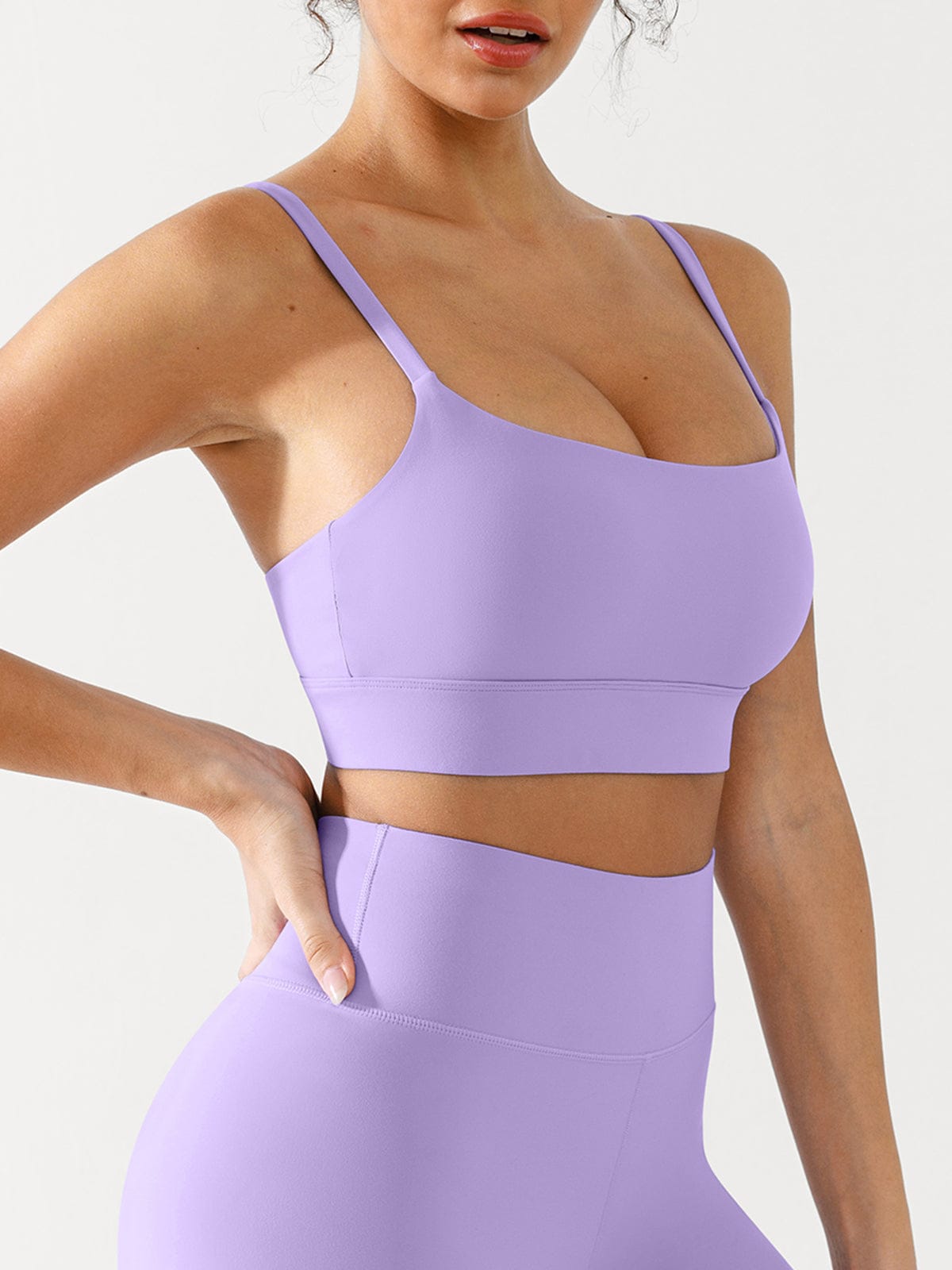 Profile view of woman in Mallow Purple adjustable sports bra by Vractive