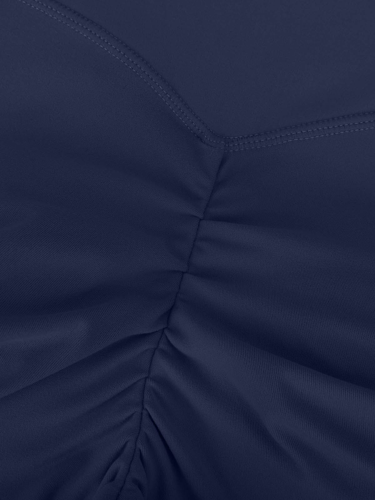 Macro view of the enhancing scrunch butt seam on Navy Blue Vractive sculpting leggings