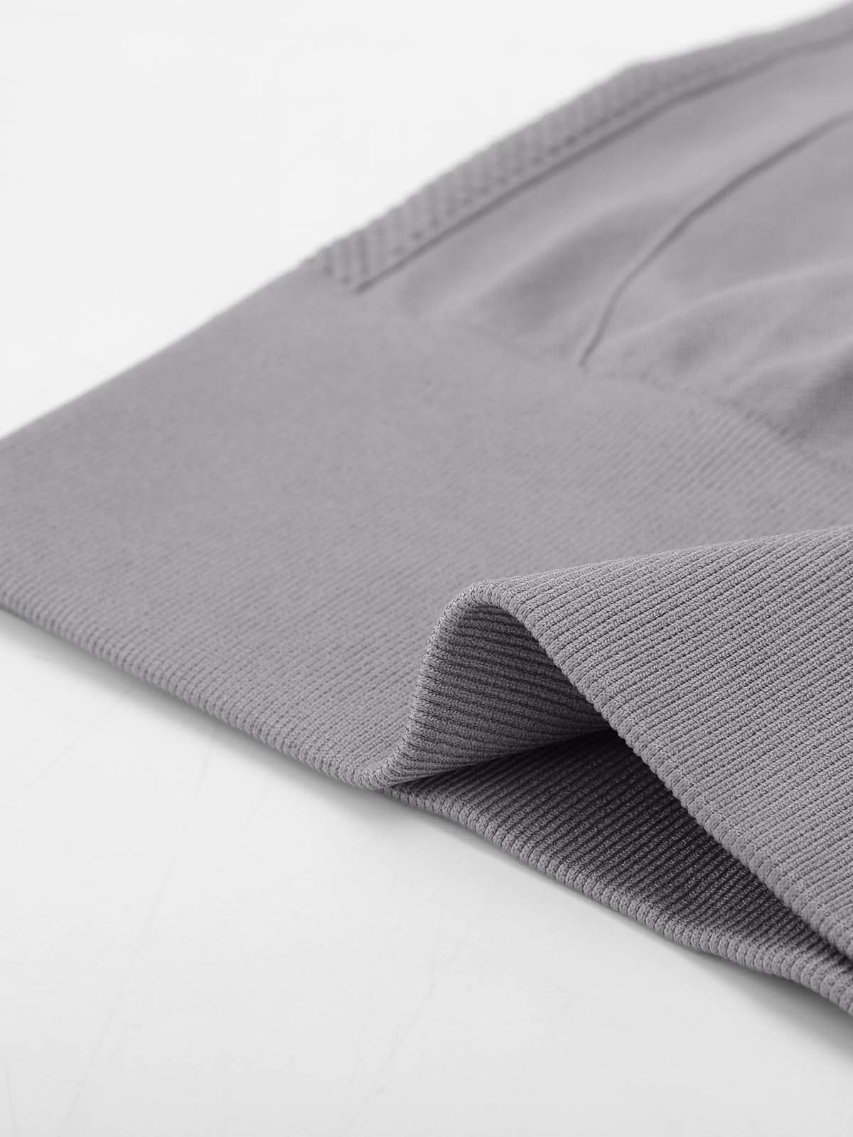 Macro texture of the breathable stretch fabric used in Vractive Lead Gray gym leggings