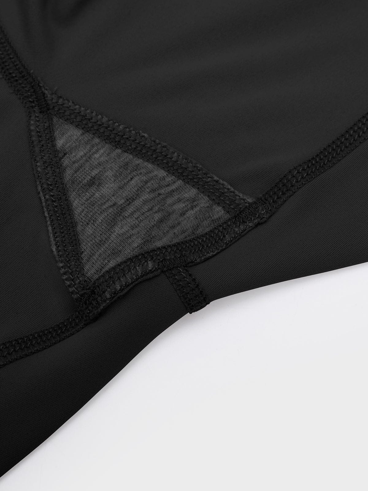 Close-up of the reinforced crotch gusset on Standard Black Vractive flared pants for anti-camel toe protection