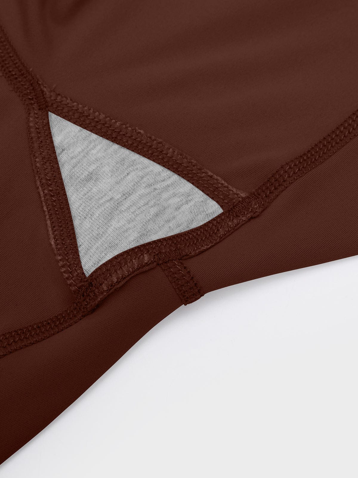 Close-up showing the functional gusset crotch design on Chocolate Brown Vractive flared activewear pants