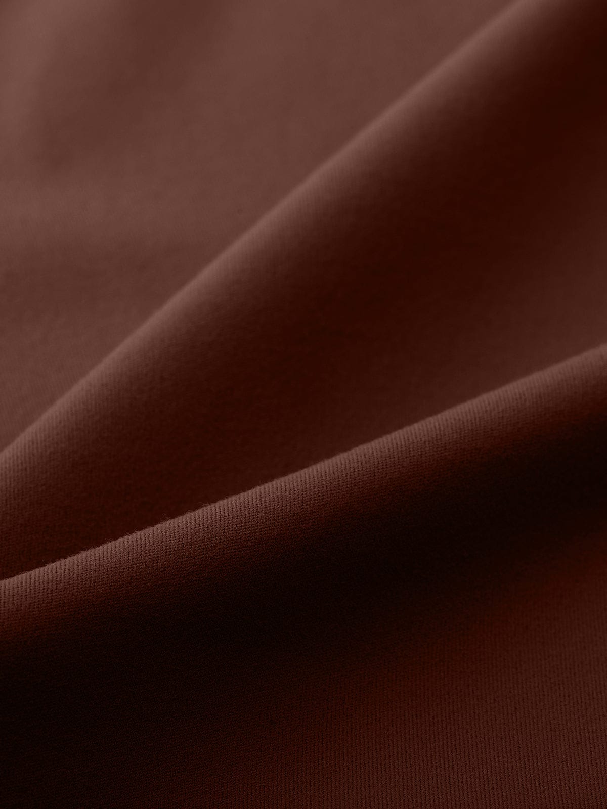 Close-up of the soft, sweat-wicking Chocolate Brown performance fabric used in Vractive flared leggings