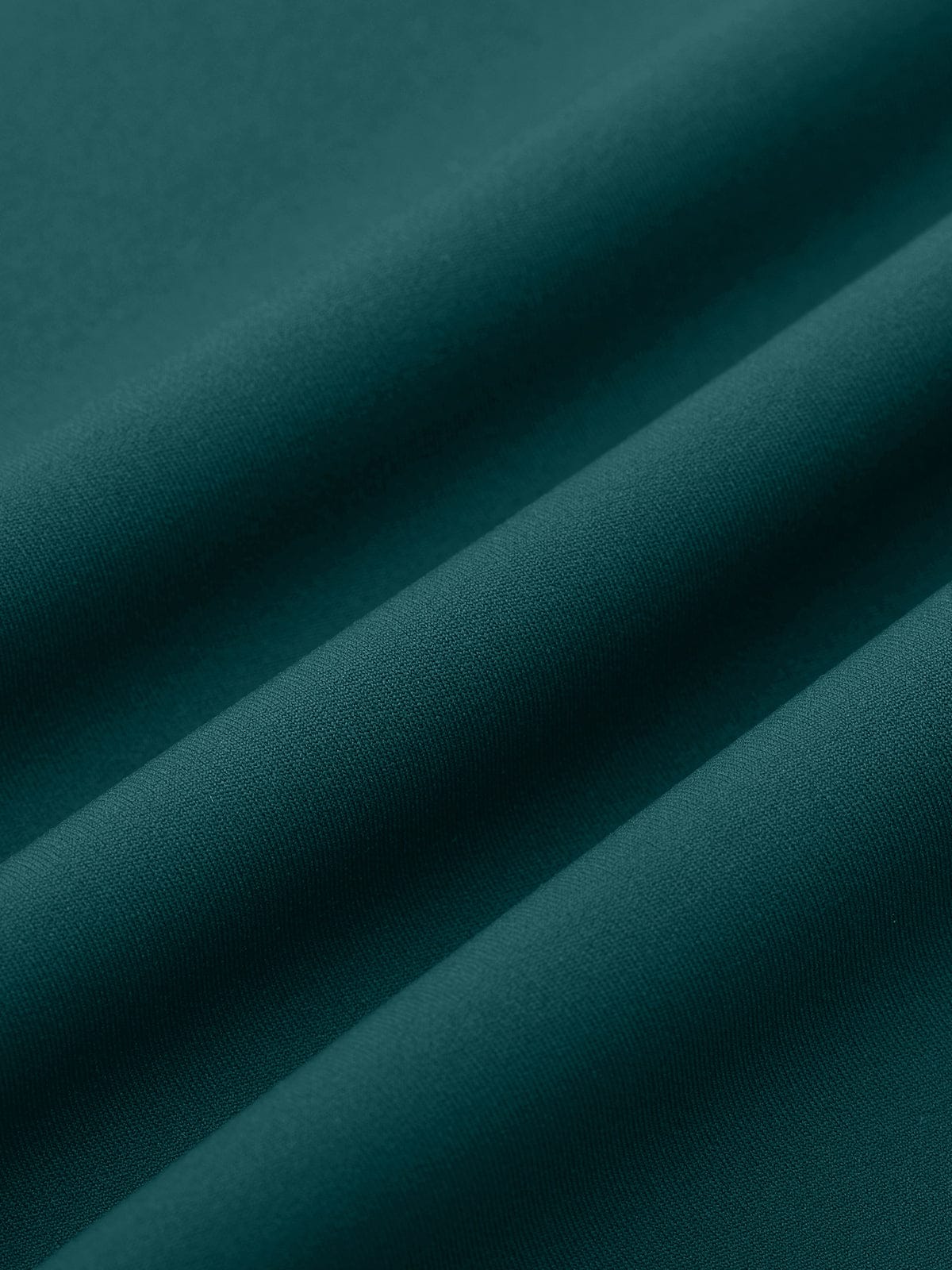 Macro texture of the breathable nylon performance fabric in Black Green by Vractive