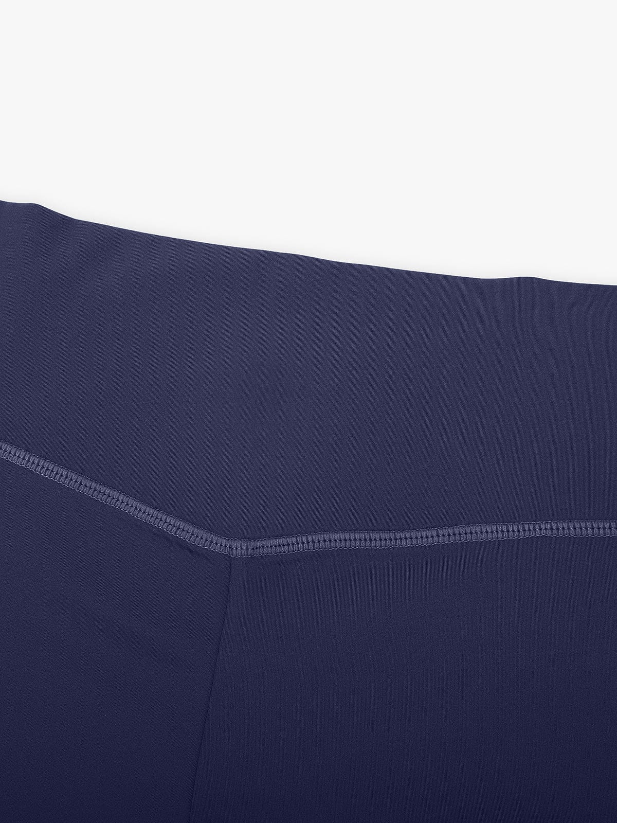 Macro view of reinforced flatlock stitching on Navy Blue Vractive flared leggings