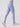 Model taking a long stride in Purple Vractive high stretch yoga pants demonstrating fabric flexibility