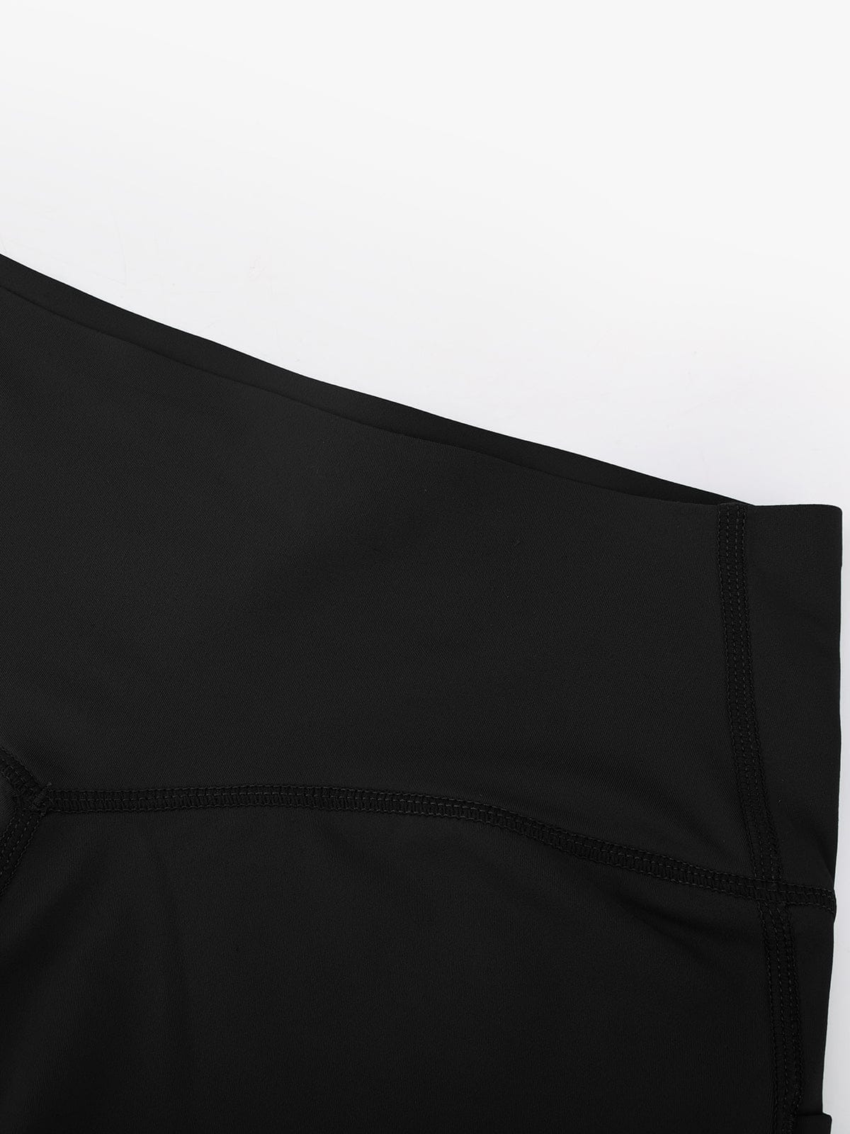 Close-up of the secure, flat-laid stitching on Standard Black Vractive multi-sport biker shorts for maximum durability