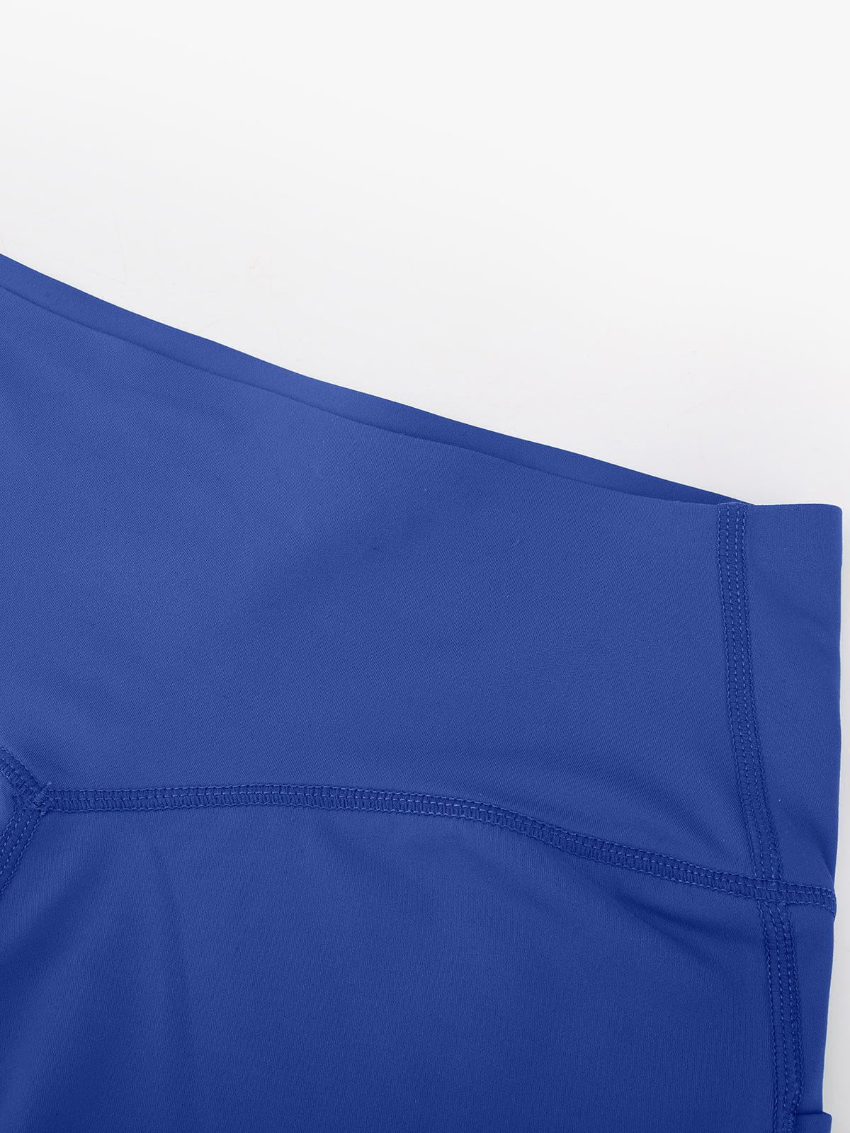 Macro view of the high-quality stitching and excellent craftsmanship on Royal Blue Vractive yoga short pants