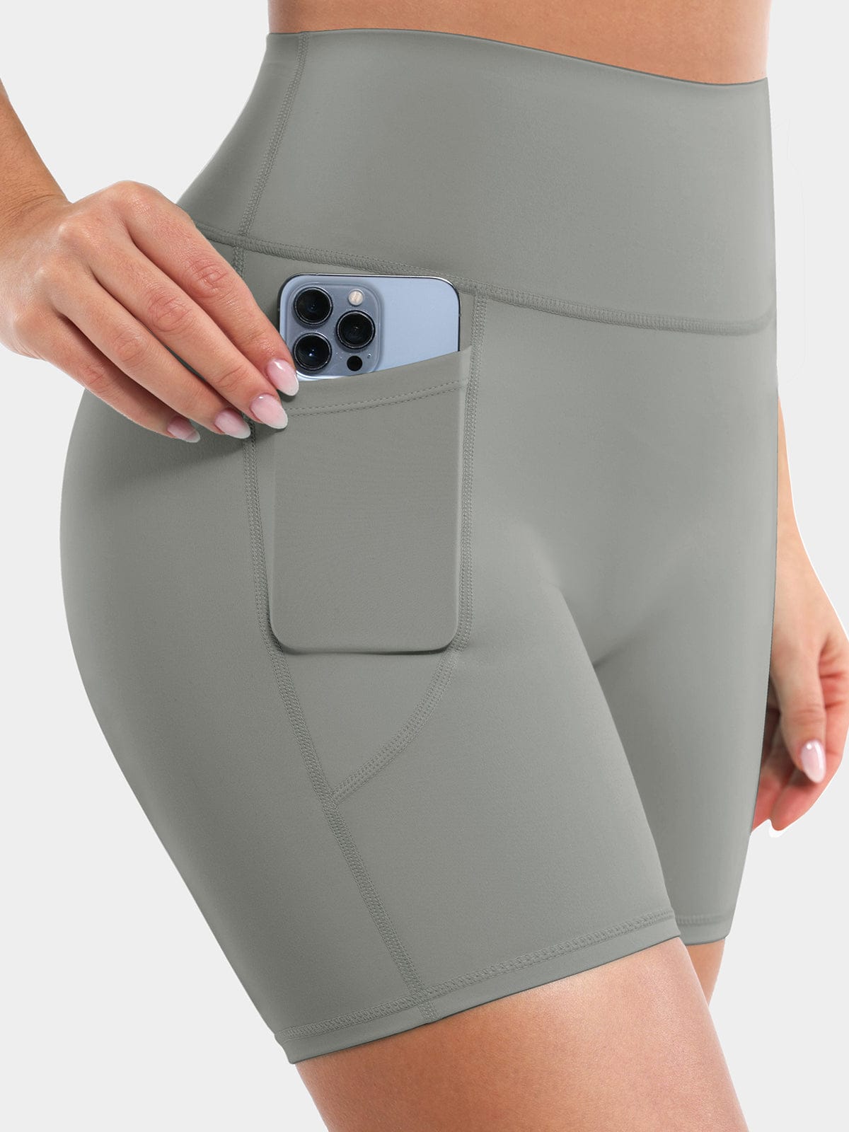 Side angle of Neutral Gray Vractive biker shorts showcasing practical side pockets