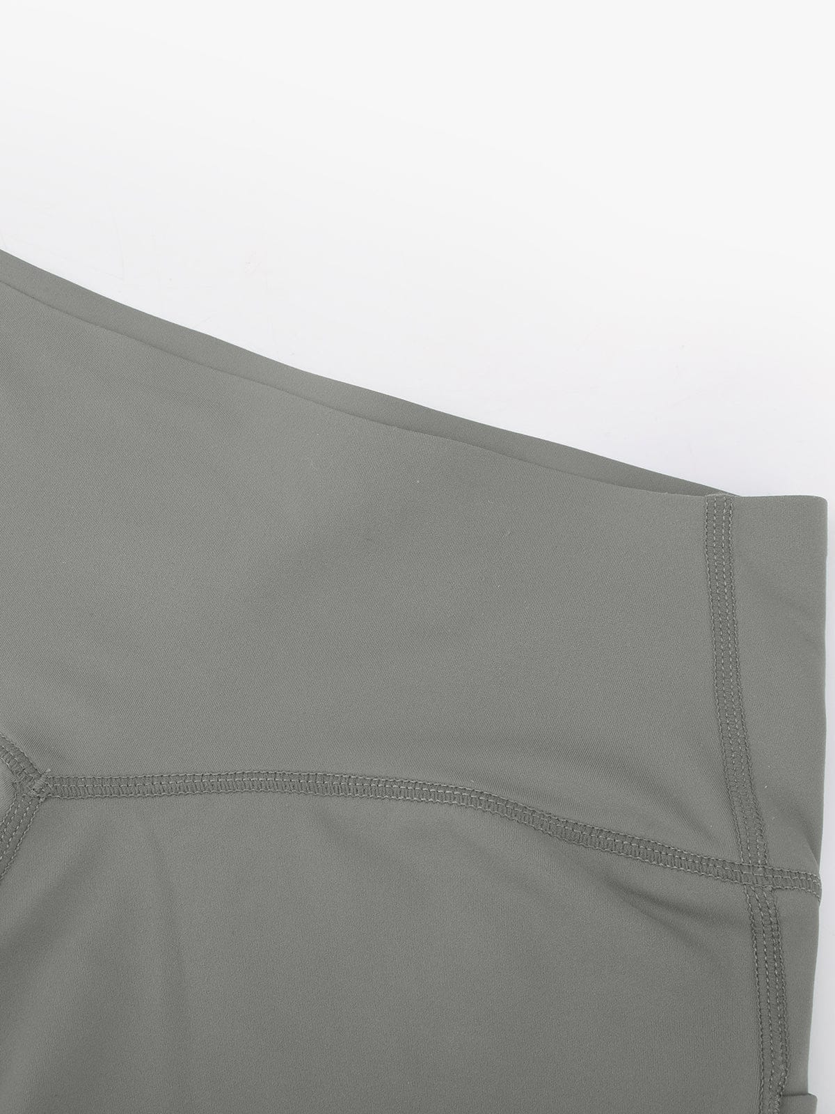 Detailed view of the smooth, comfortable seams and neat stitching on Neutral Gray Vractive activewear shorts