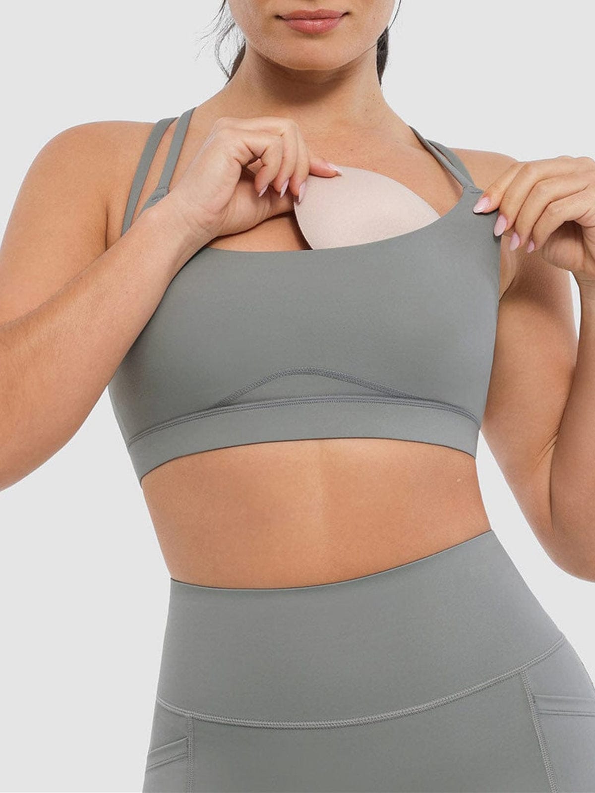Neutral Gray lightweight sports bra by Vractive showing the removable cups feature for easy cleaning and customized padding.