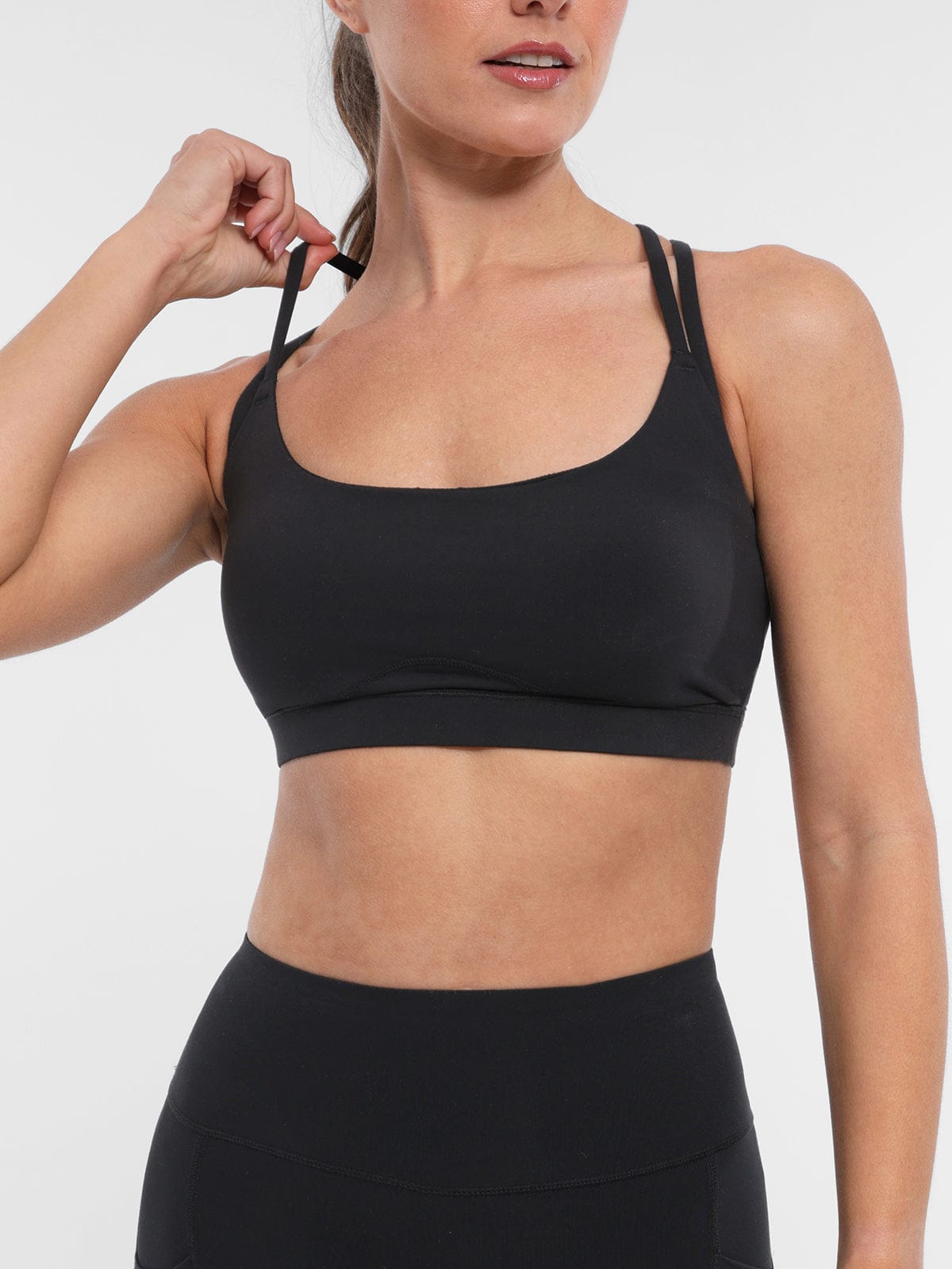 Vractive black lightweight sports bra with removable cups front view
