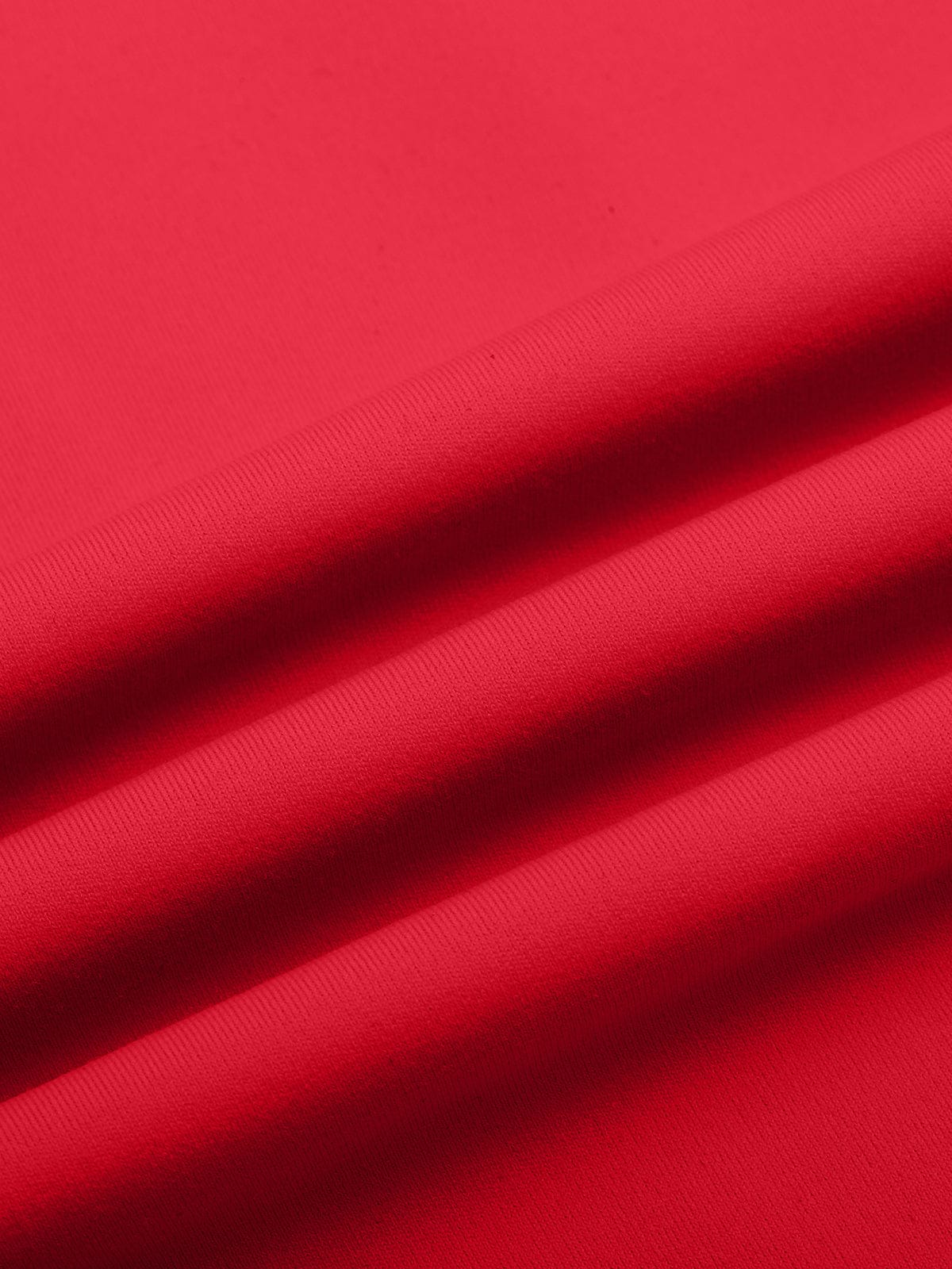 Macro shot of Chili Red performance fabric on Vractive cross-back sports bra
