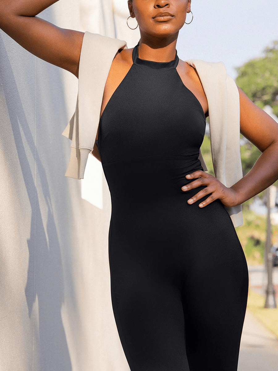 Black Vractive one piece halter jumpsuit in active pose, thigh slimming shapewear
