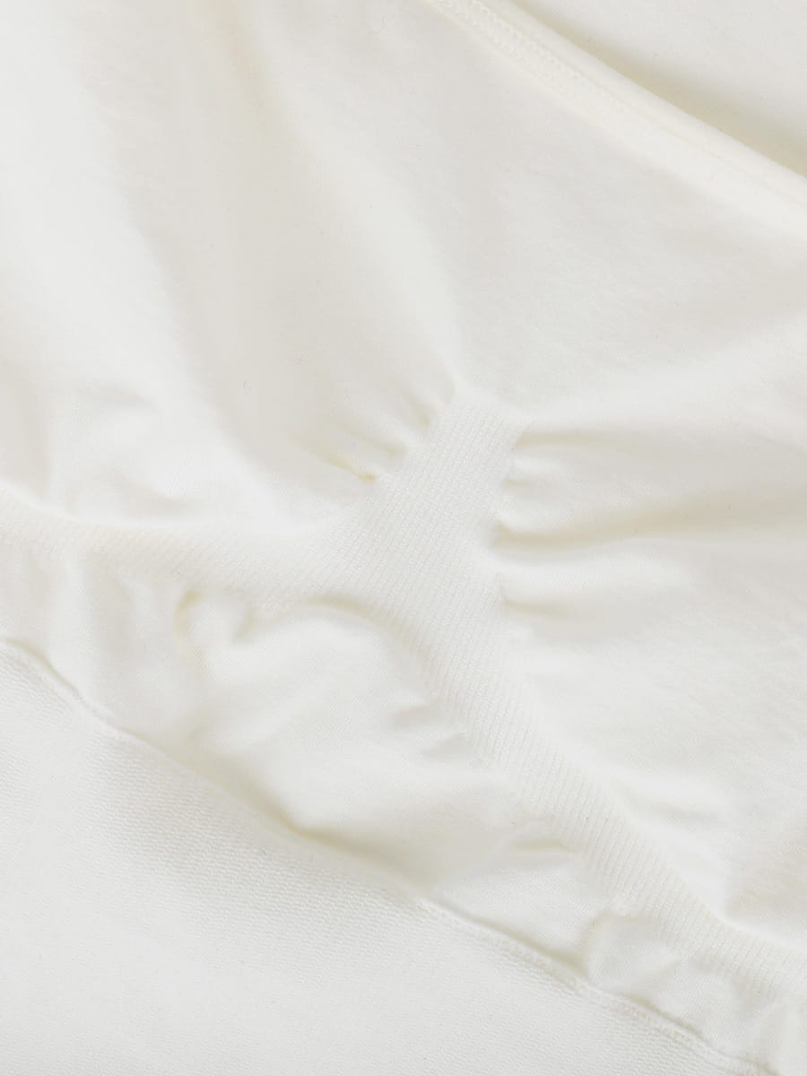white-shaping-romper-flat-lay-bra-detail