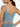 Back view of light blue Vractive U-back sleeveless athletic top, solid color workout apparel

