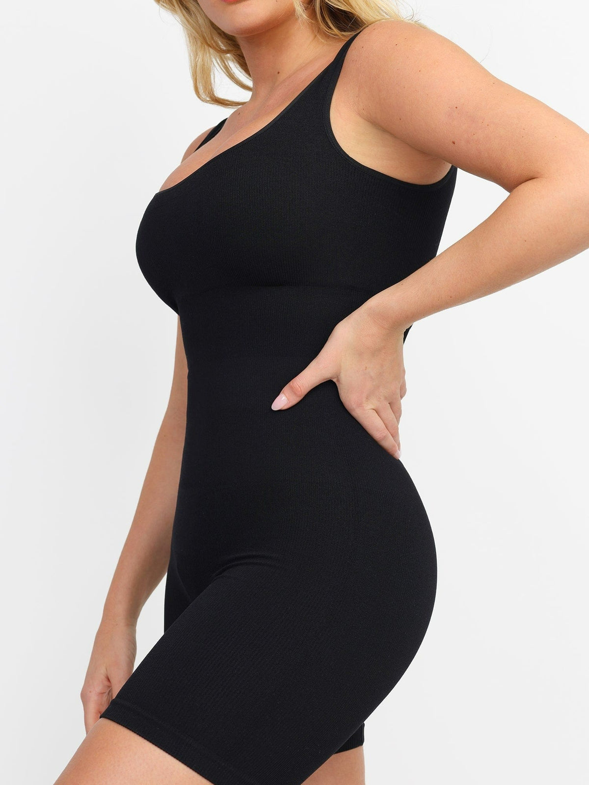 Side view of black Vractive seamless square neck sport romper, one piece activewear
